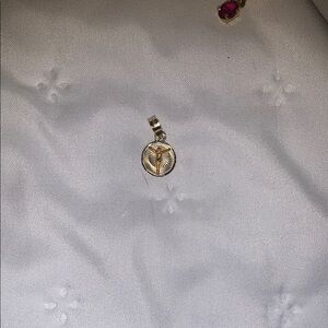 14 karat gold diamond cut Jesus coin appendant